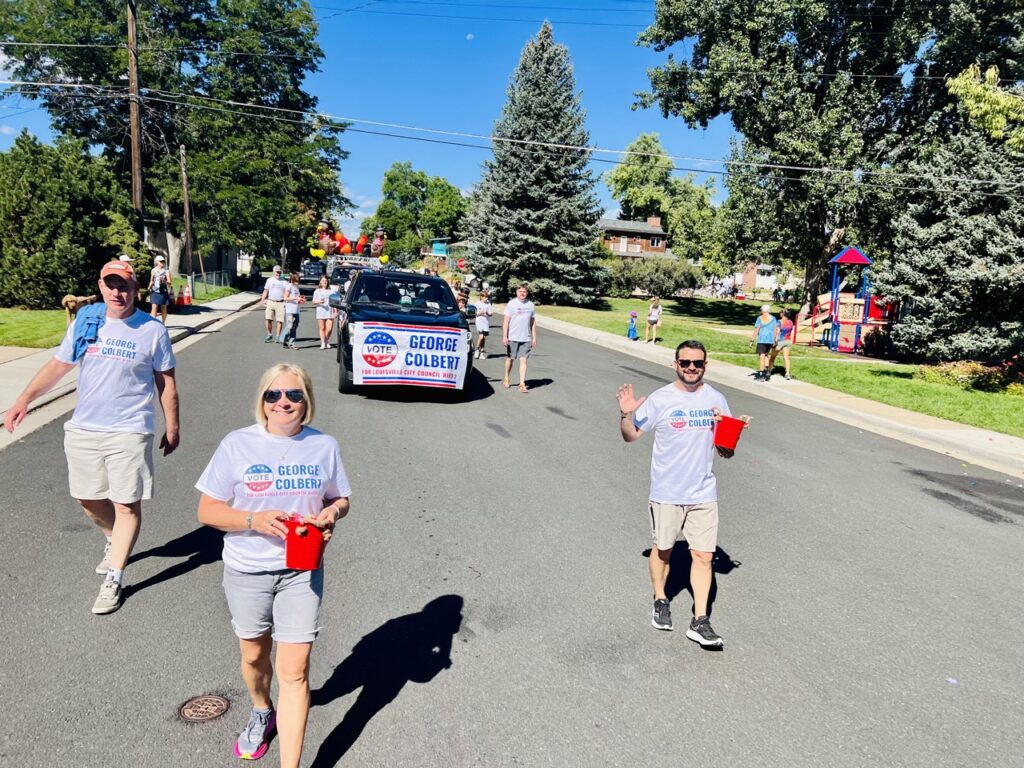 George and Michael Ann handing out candy during the Louisville Labor Day parade